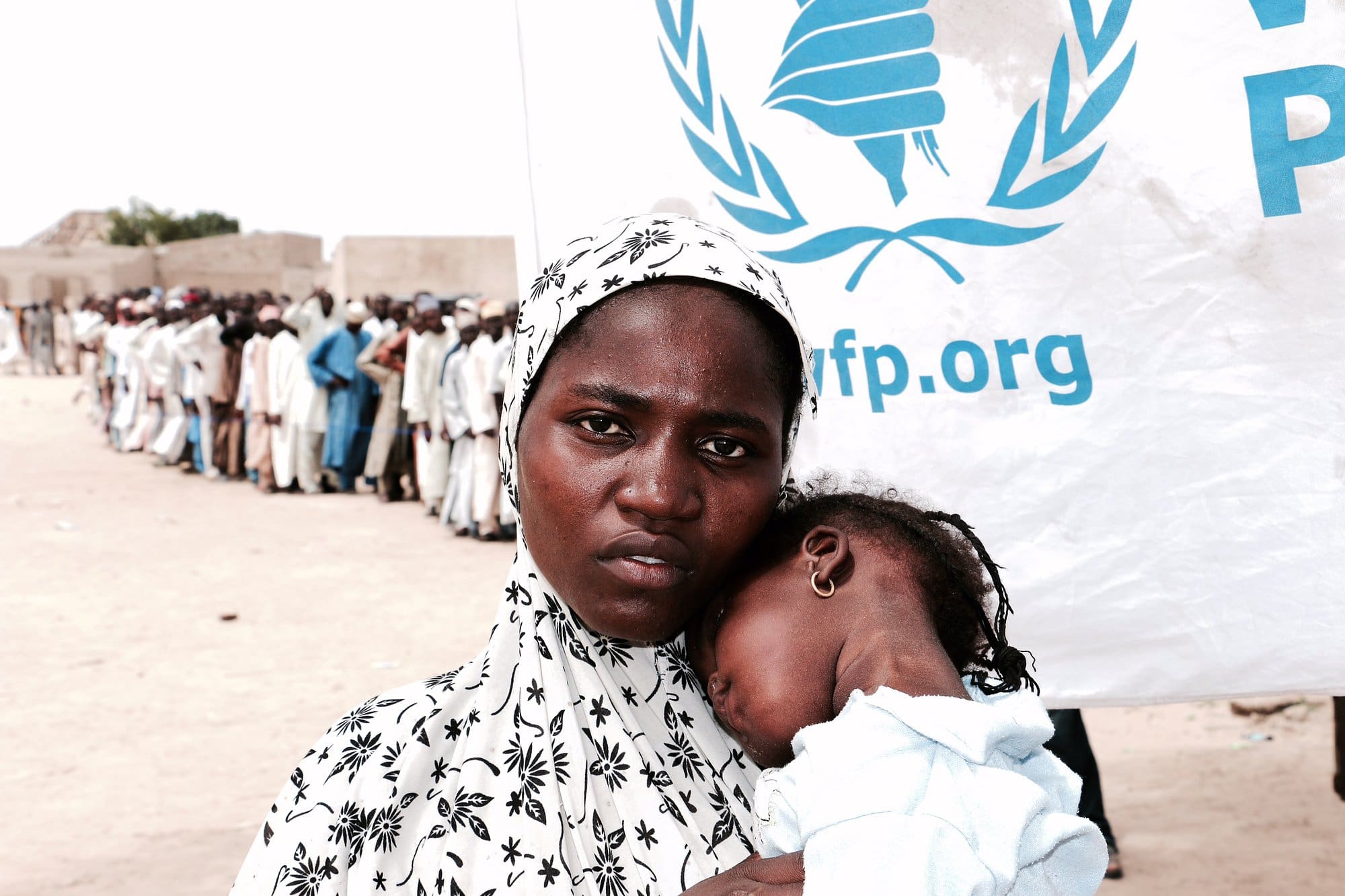 This mother in Maiduguri, Nigeria is among tens of thousands of displaced people who rely on monthly cash assistance of roughly $12 per month from WFP to feed her child.