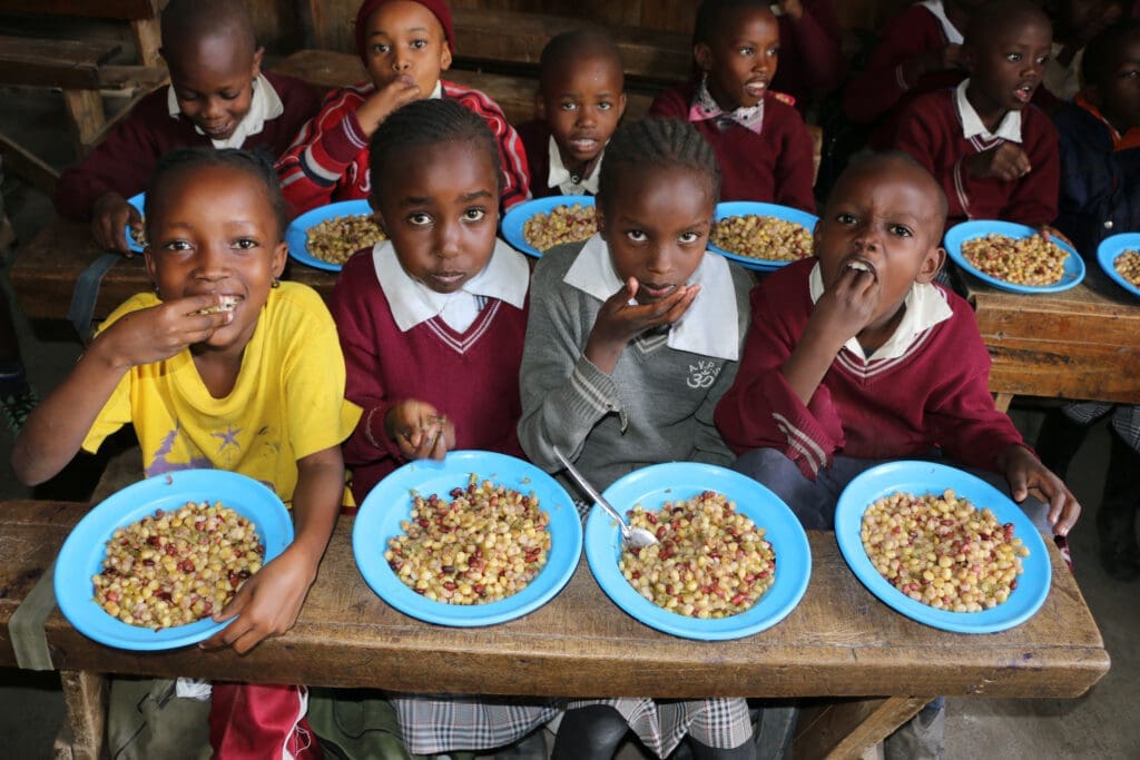 School children enjoy a lunch made with salvaged vegetables.