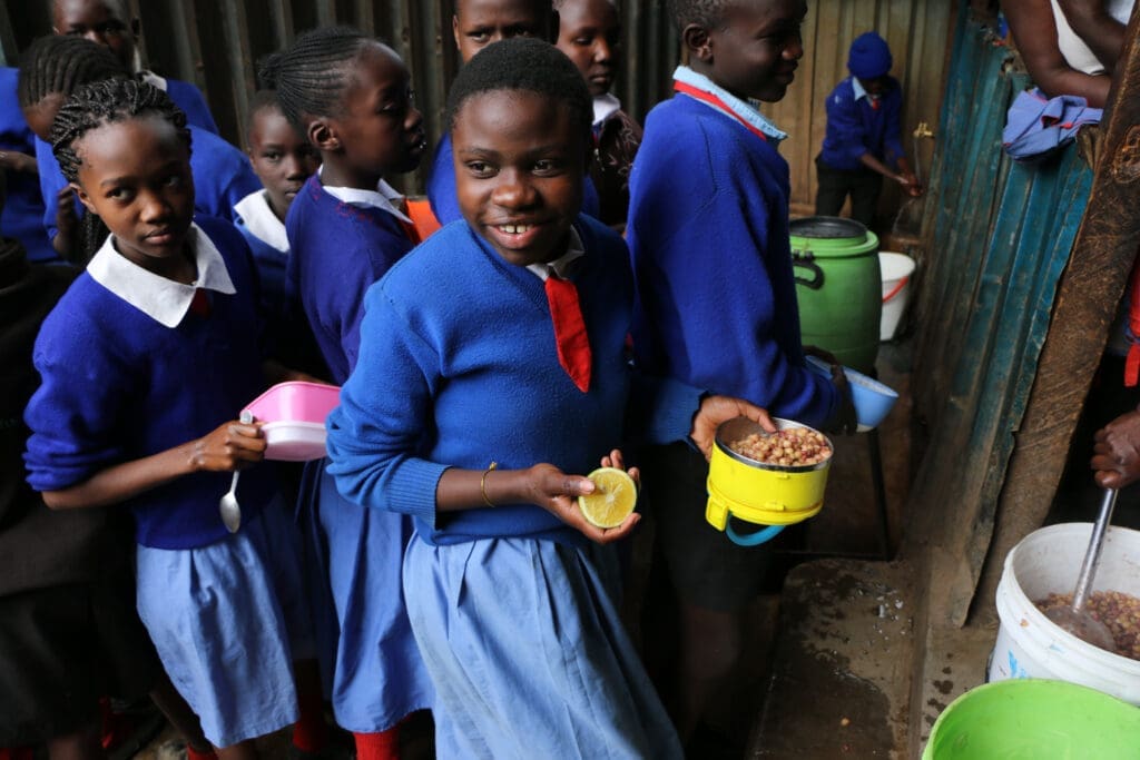 Students collect their lunch in Nairobi.