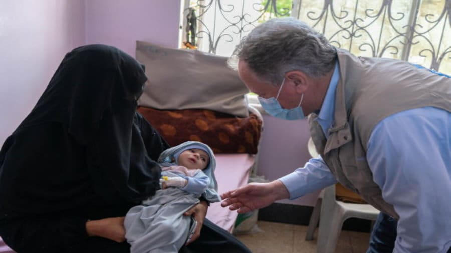 WFP Executive Director David Beasley speaks to mother and child in Yemen