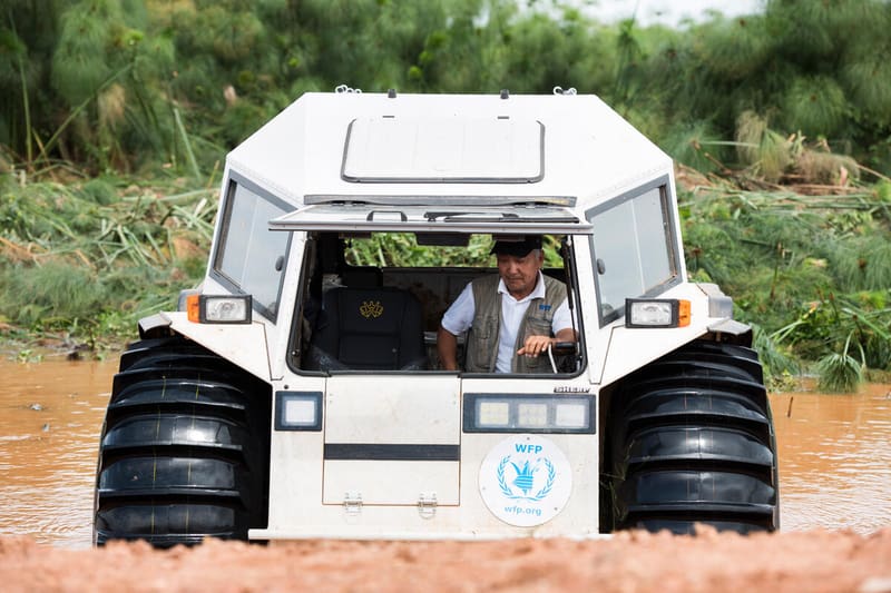 WFP all-terrain vehicle drives through muddy water