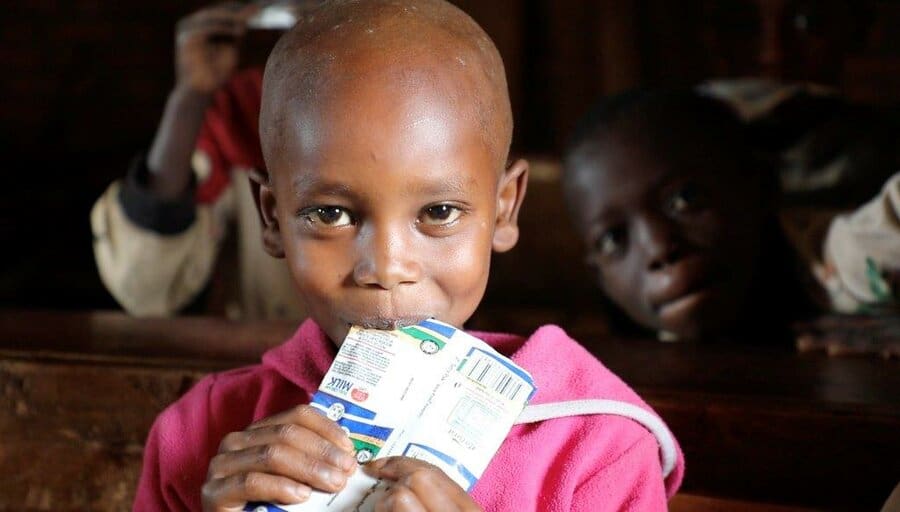 young girl eating nutrition bar