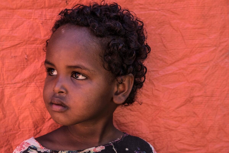 Young girl in Tigray, Ethiopia, where conflict is causing famine.