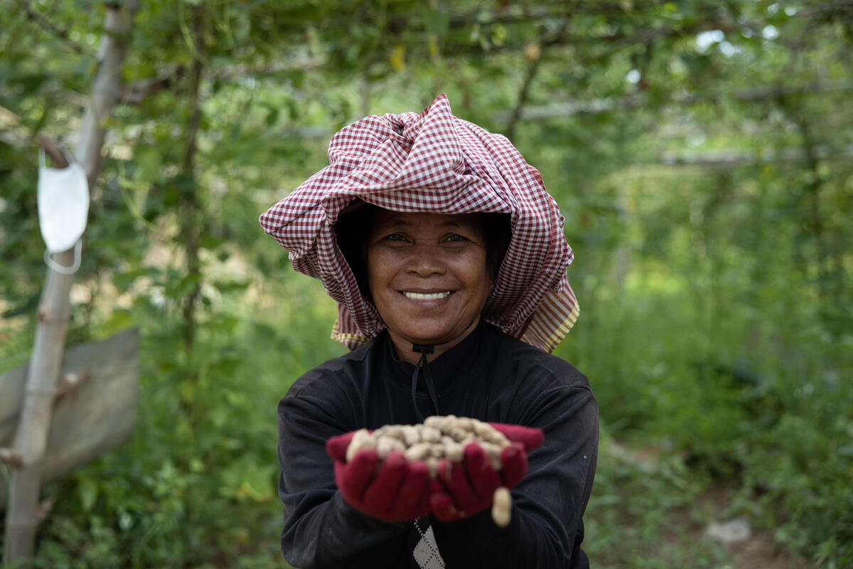 woman in vegetable garden smiling