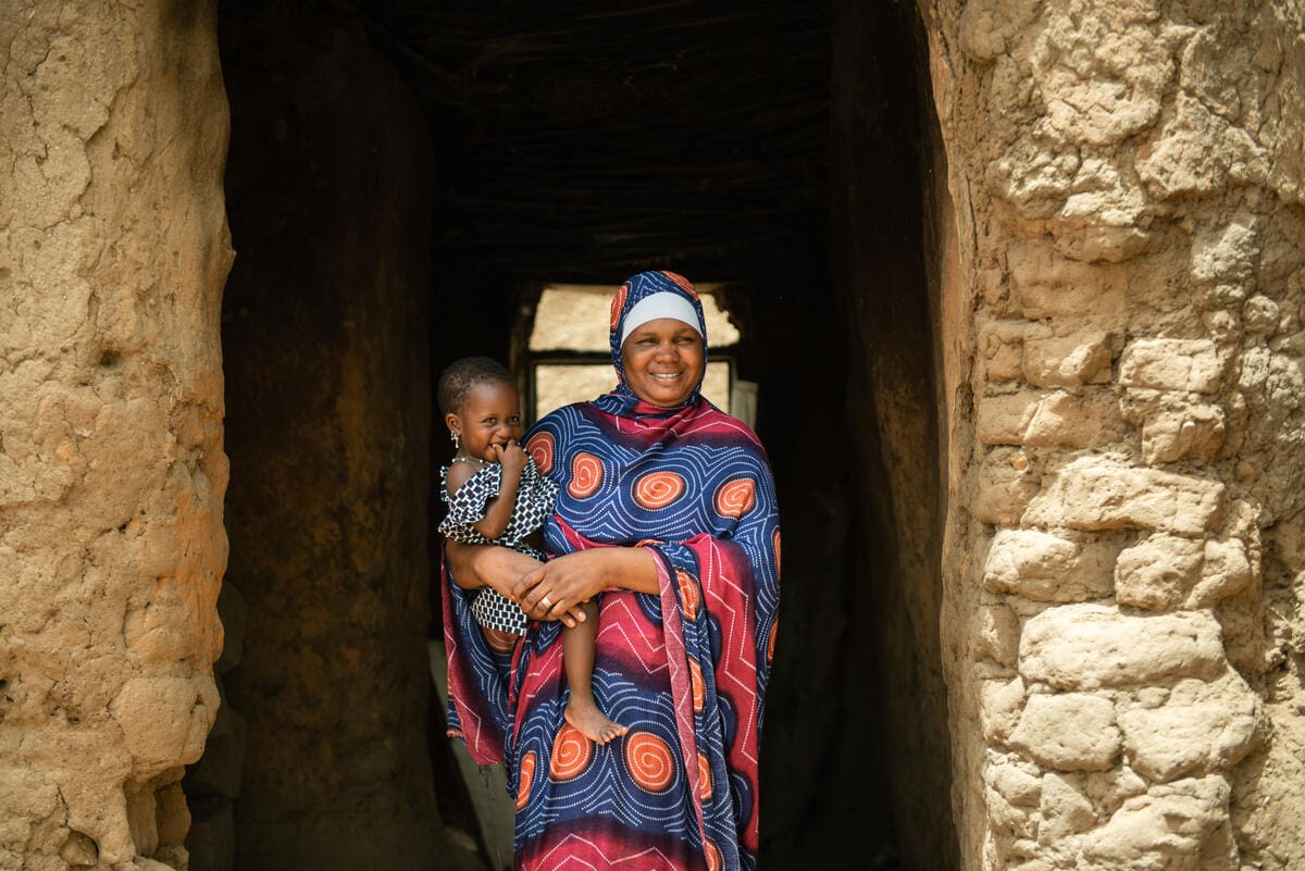 Fada holding her young girl in Mali