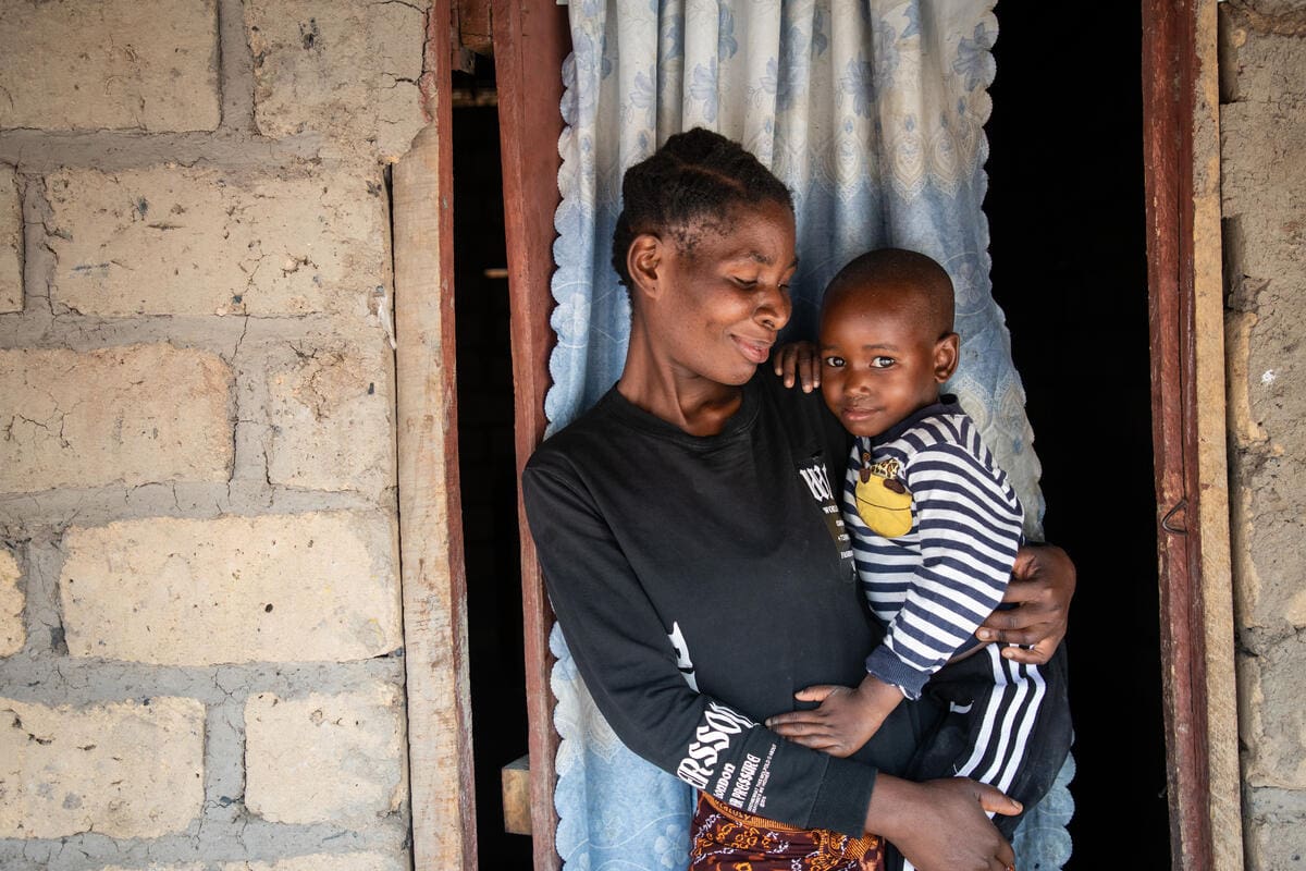 Mother holding her son in Zambia