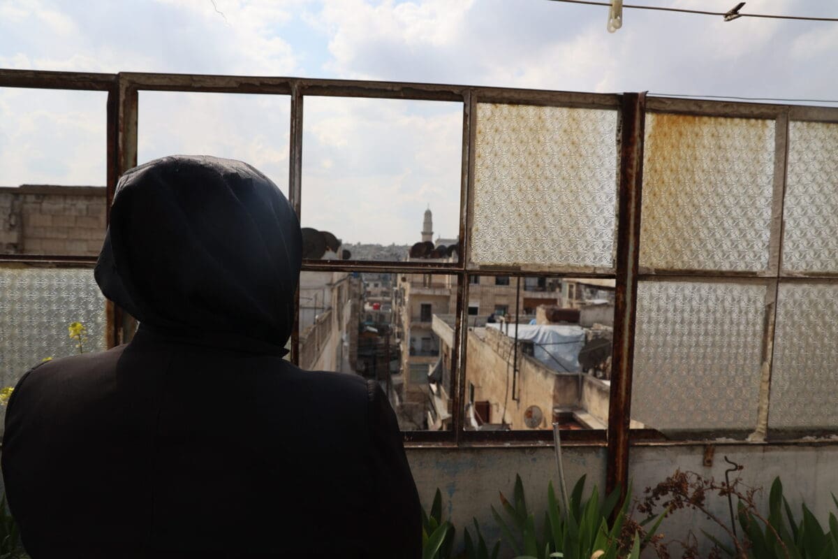 Ghufran looking out at city of Aleppo in Syria