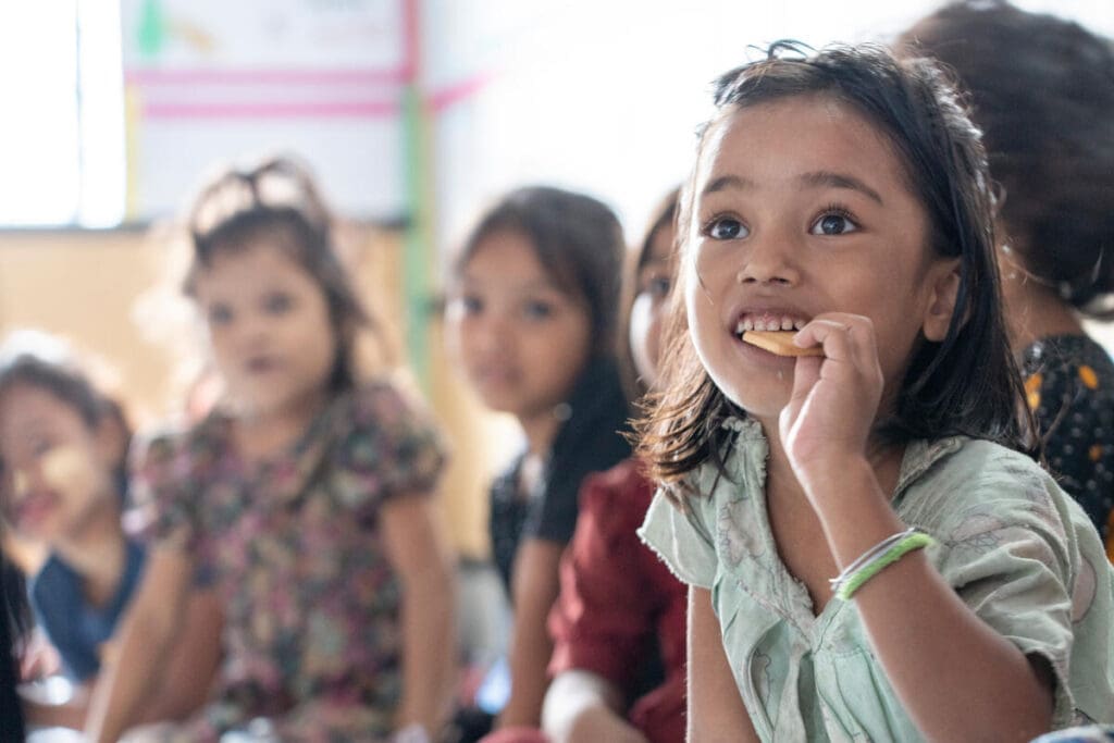Students in Bangladesh eat a school meal